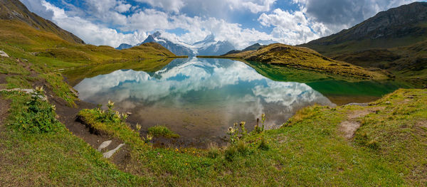 Panoramic view of lake and mountains against sky