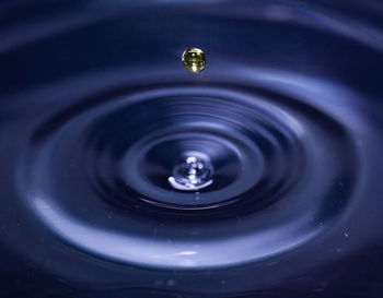 High angle view of drop falling in water