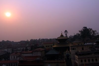 View of built structures at sunset