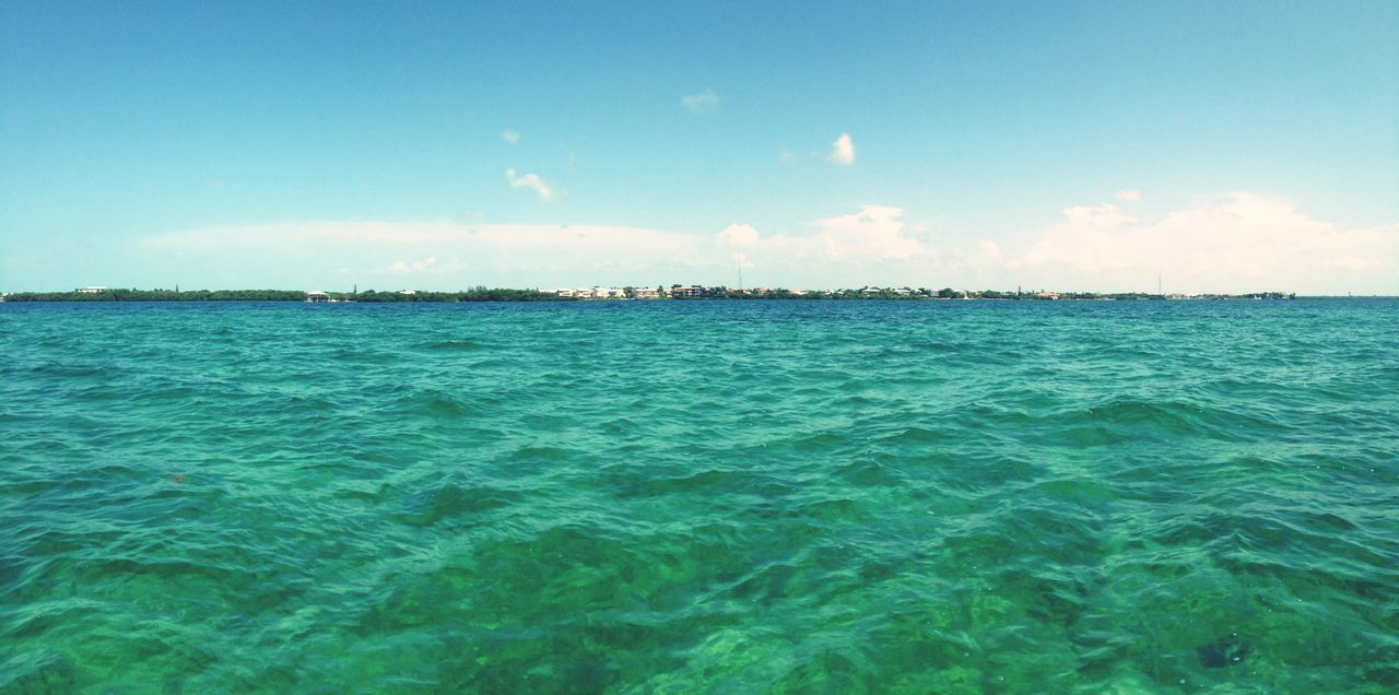 water, sea, blue, waterfront, sky, scenics, beauty in nature, tranquil scene, tranquility, rippled, nature, horizon over water, turquoise colored, idyllic, day, seascape, wave, outdoors, no people, beach