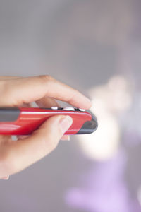 Close-up of woman hand holding mobile phone