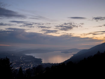 Scenic view of silhouette mountains against sky at sunset