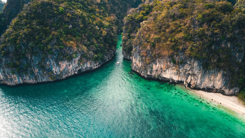 High angle view of water flowing through rocks