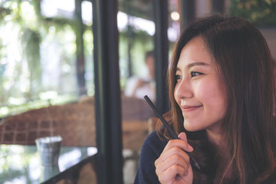 Portrait of woman looking at camera