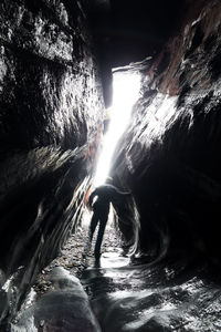 Man swimming in cave