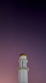 Minaret of mosque in night time