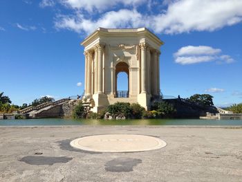 Historic saint-clement aqueduct at promenade du peyrou against sky