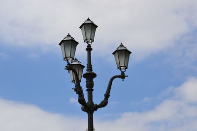 Low angle view of street light against sky