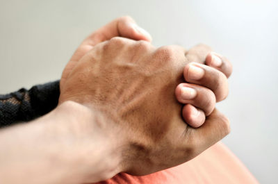 Close-up of couple holding hands