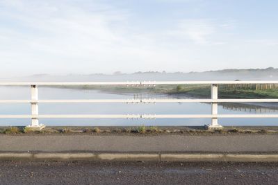 Bridge over sea against sky