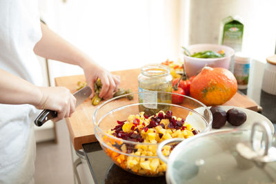 Midsection of man preparing food on table
