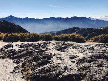 Scenic view of silhouette mountains against sky