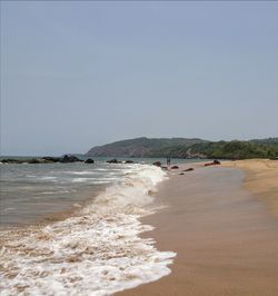 Scenic view of beach against clear sky