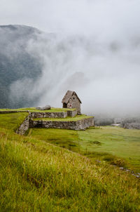 House on field against sky