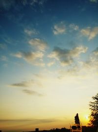 Scenic view of field against sky at sunset