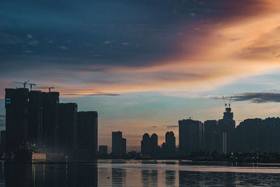 Silhouette of city at sunset