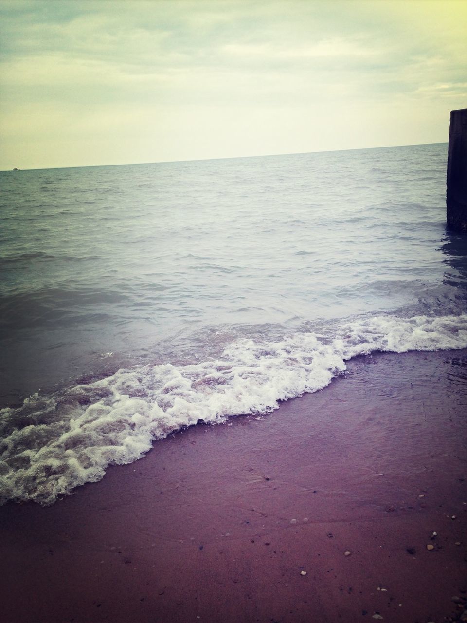 sea, water, horizon over water, sky, beach, scenics, tranquil scene, beauty in nature, wave, tranquility, shore, cloud - sky, nature, surf, idyllic, cloudy, cloud, coastline, dusk, seascape