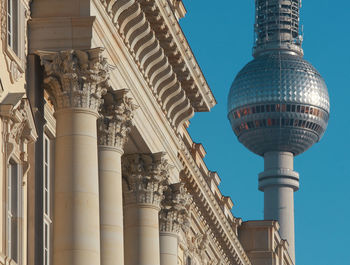 Facade details of berlin palace with television tower in background 