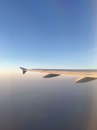 Airplane flying over blue sky