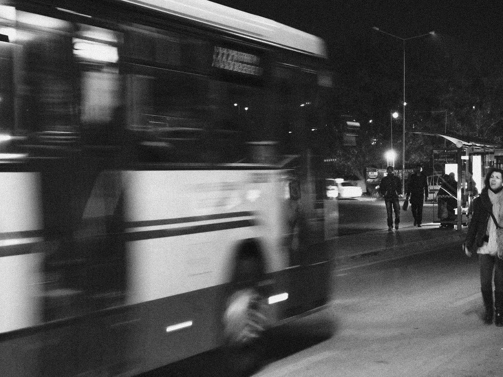 transportation, mode of transport, land vehicle, car, on the move, travel, public transportation, illuminated, street, blurred motion, road, night, men, city life, motion, railroad station platform, train - vehicle, city