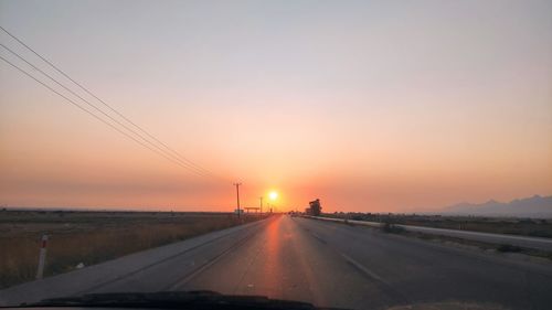 Road against sky during sunset