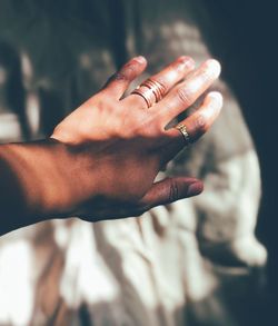 Sunlight falling on woman wearing rings