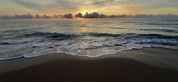 Scenic view of sea against sky during sunset