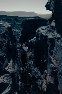 Panoramic view of rock formation in sea against sky