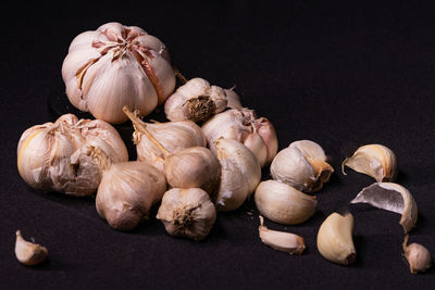 High angle view of pumpkins on table against black background