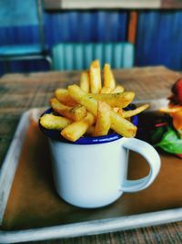 Close-up of burger and fries on table