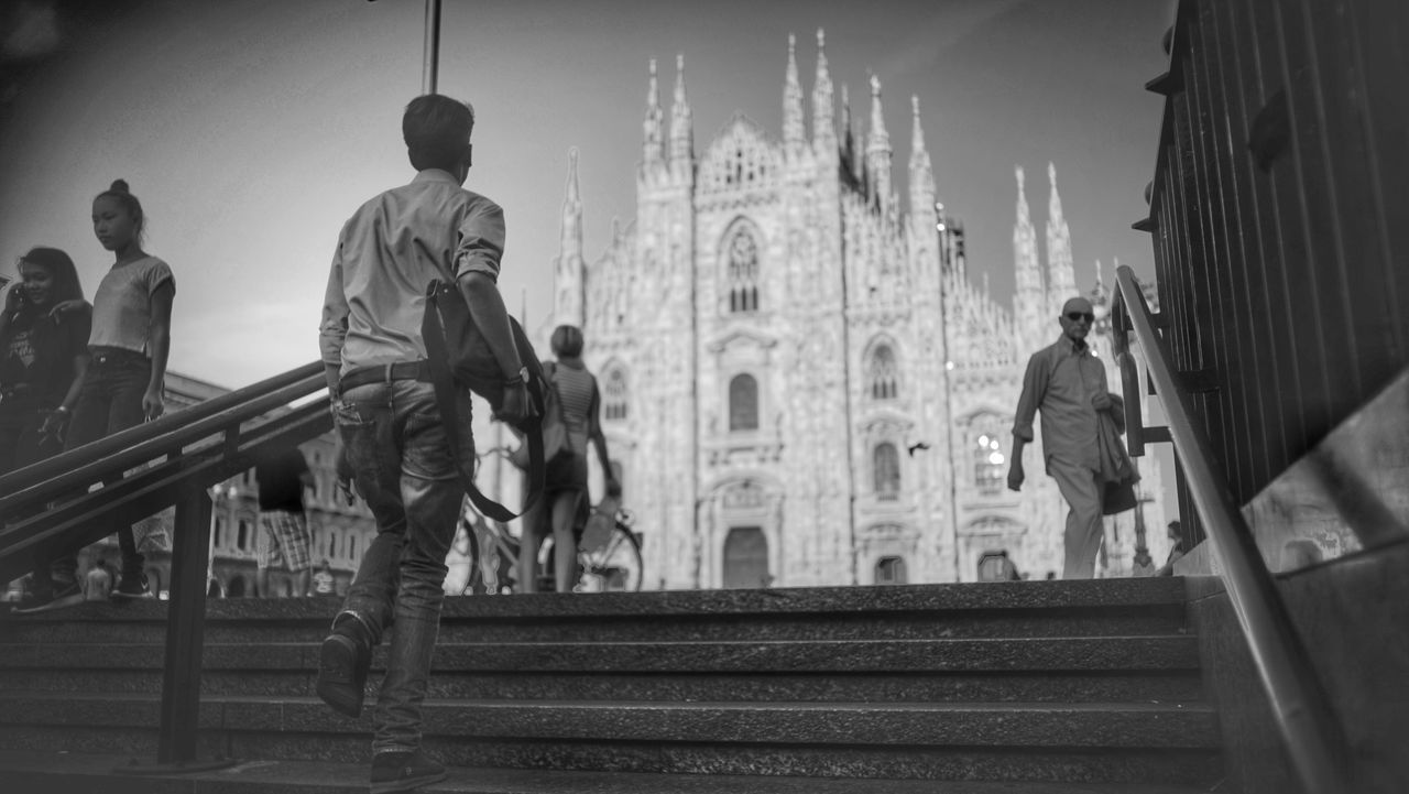 architecture, built structure, building exterior, men, lifestyles, famous place, travel destinations, tourism, full length, statue, city, travel, sky, steps, leisure activity, rear view, religion, sculpture