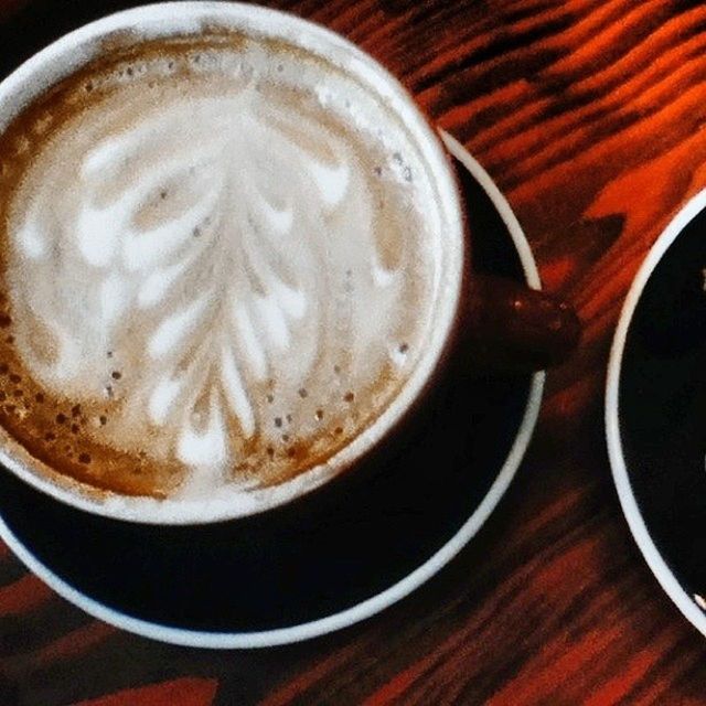 food and drink, drink, coffee cup, refreshment, indoors, coffee - drink, frothy drink, cappuccino, froth art, freshness, saucer, table, coffee, still life, close-up, latte, cup, spoon, high angle view, directly above