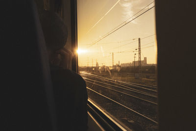 Railroad tracks seen through train window