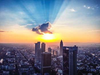 Aerial view of city at sunset