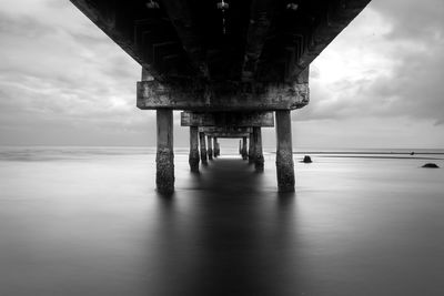 View of pier over sea against sky