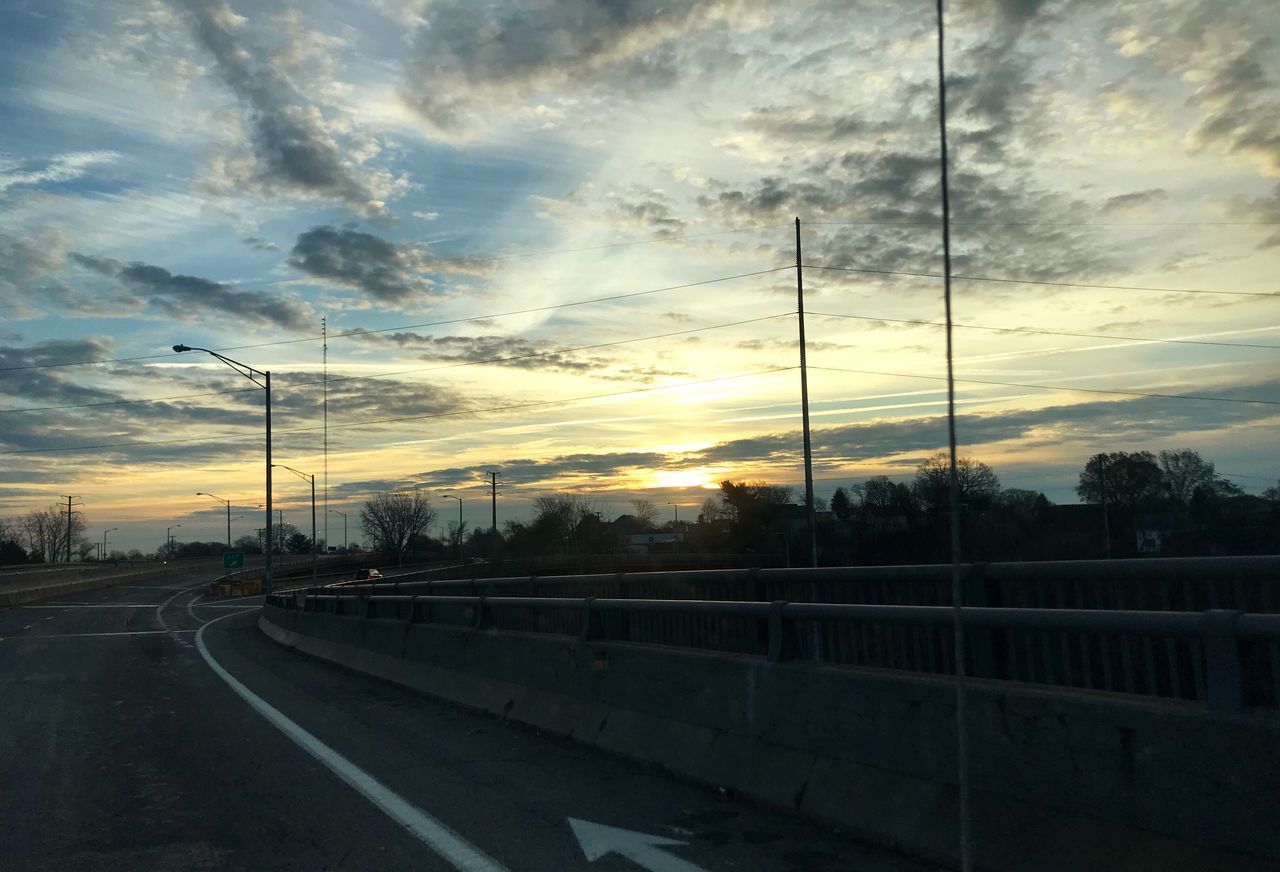 ROAD AGAINST SKY DURING SUNSET