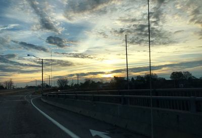 Road against dramatic sky during sunset