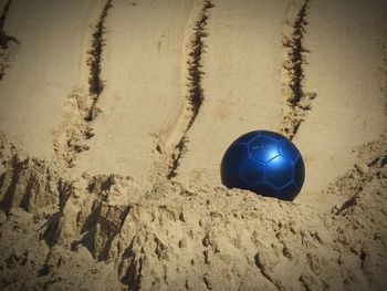 High angle view of ball on sand at beach