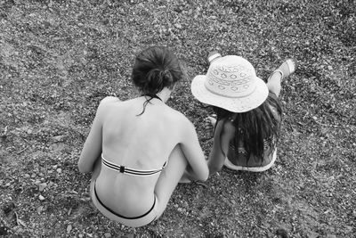 High angle view of woman and girl relaxing outdoors