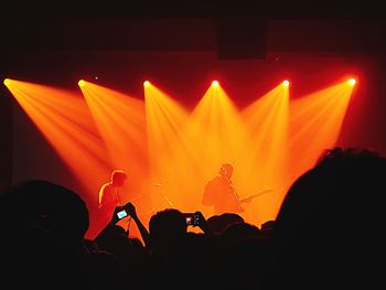 Silhouette people at music concert