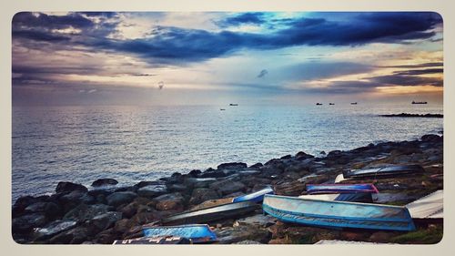 Boats moored on beach