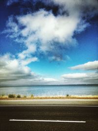 Scenic view of sea against cloudy sky