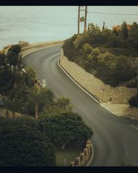 High angle view of road by sea against sky