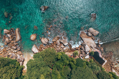 High angle view of rocks by sea