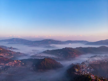 Scenic view of mountains against sky during sunset