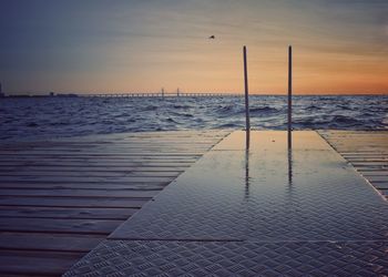 Scenic view of sea against sky at sunset