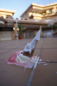 Close-up of ice cream cone on paper