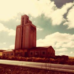 View of built structure against cloudy sky