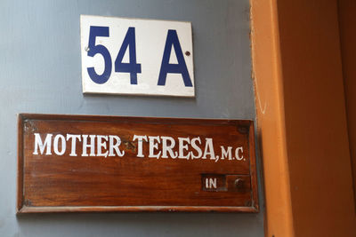 Close-up of information sign on wall