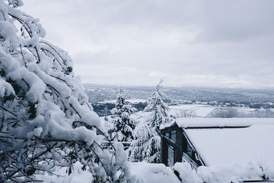 Snow covered landscape against sky